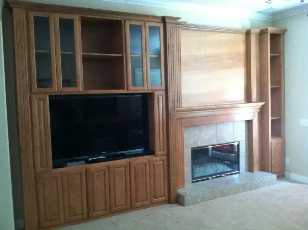 Fireplace media cabinetry by G & L Cabinets